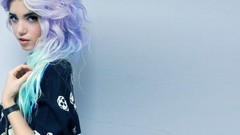 Woman blue background purple hair