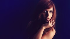 Woman blue background rings blurred models redheads fingers on 