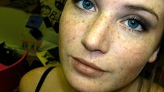 Woman blue eyes freckles