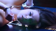 Woman blue eyes handcuffs