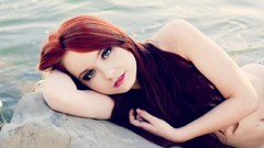 Woman blue eyes lying down redheads