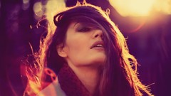 Woman bokeh sunlight lens flare smiley face hair in face