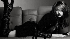 Woman boots miley cyrus lying down grayscale