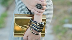 Woman bottom close-up Profile Camille rings handbag outdoors 