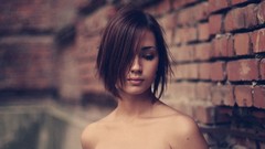 Woman brunettes brick wall