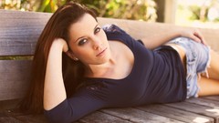 Woman brunettes cleavage laying on side