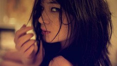 Woman brunettes models hair in face upscaled