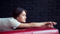 Woman brunettes models lying down brick wall Femjoy magazine 