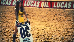 Woman brunettes racing Rockstar (energy drink)