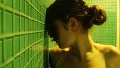 Woman brunettes shower holding boobs