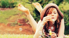 Woman bubbles soap blowing bubbles