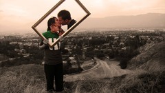 Woman Cameras kissing