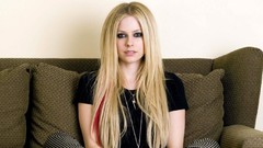Woman Celebrity Avril Lavigne faces sitting blondes couch 