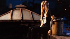 Woman Celebrity Avril Lavigne sitting blondes long hair blue 