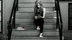 Woman Celebrity Avril Lavigne sitting singers stairways 