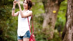 Woman Celebrity Cameras handbag outdoors asians brunettes 