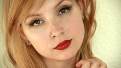 Woman close-up blondes green eyes red lipstick pale skin