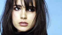 Woman close-up blue background Celebrity Actress long hair 