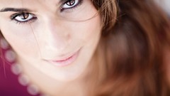 Woman close-up blurred brown eyes