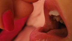 Woman close-up eating open mouth giant woman