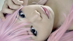 Woman close-up faces asians pink hair