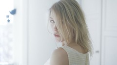 Woman close-up faces blondes looking back