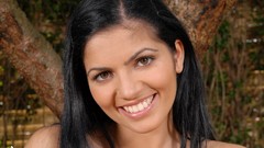 Woman close-up faces outdoors smiling long hair brown eyes 
