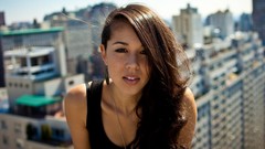 Woman close-up faces sitting outdoors long hair brown eyes 