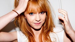 Woman close-up faces smiling long hair blue eyes singers 