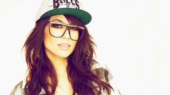 Woman close-up glasses white background faces brown eyes 