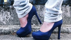 Woman close-up jeans high heels