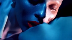 Woman close-up kissing models