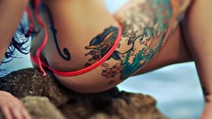 Woman close-up legs tattoos bikini Sakura Redd