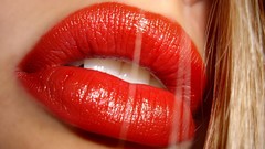 Woman close-up lips blondes red lipstick