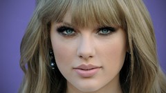 Woman close-up lips blondes taylor swift purple background