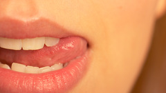 Woman close-up lips tongue