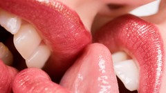 Woman close-up lips tongue kissing lesbians