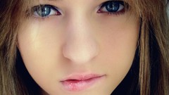 Woman close-up long hair biting lips