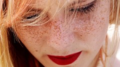 Woman close-up Shelby freckles red lipstick redheads