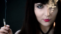 Woman close-up smoking black hair