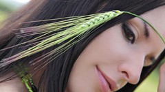 Woman close-up spikelets faces brunettes