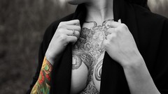 Woman close-up tattoos boobs