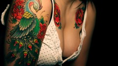 Woman close-up tattoos cleavage