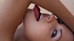 Woman close-up tongue licking open mouth