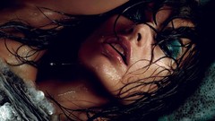 Woman close-up wet Milla Jovovich faces