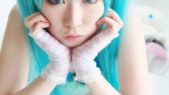 Woman cosplay vocaloid hatsune
