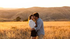 Woman couple fields kissing