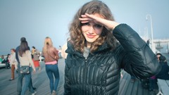 Woman crowd smiling hands on face