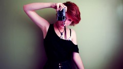 Woman Don Cameras Go board game