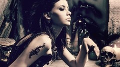 Woman Dragons keys skulls tattoos brunettes black dress